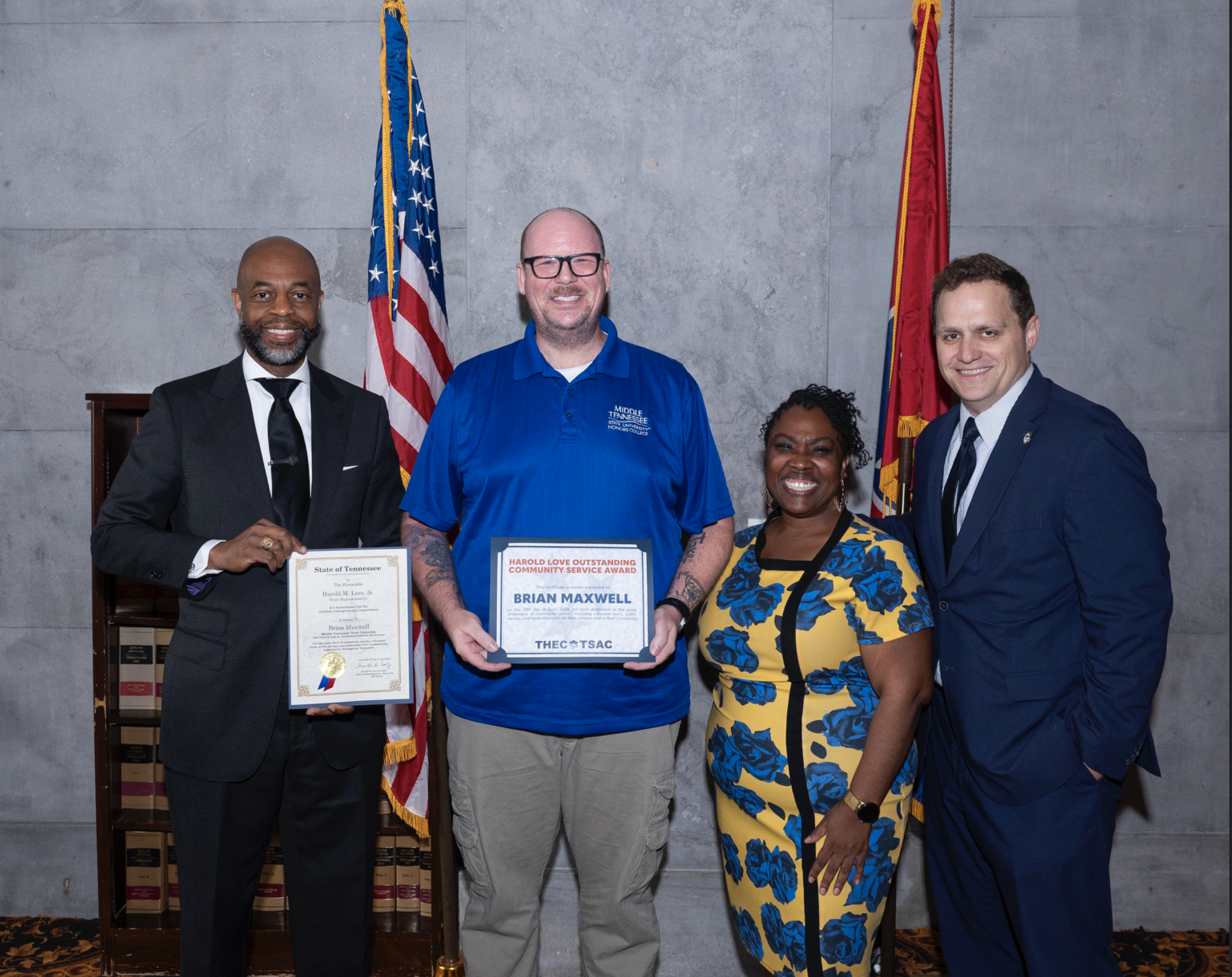 Graduating senior video and film production major Brian Maxwell, second from left, receives his 2024 Harold Love Outstanding Community Service Award April 29 at the Tennessee Capitol in Nashville, Tenn. Presenting the award are, from left, state Rep. Harold Love Jr. of Nashville, Tennessee Higher Education Commission Director of HBCU Success Brittany Mosby and THEC Executive Director Steven Gentile.